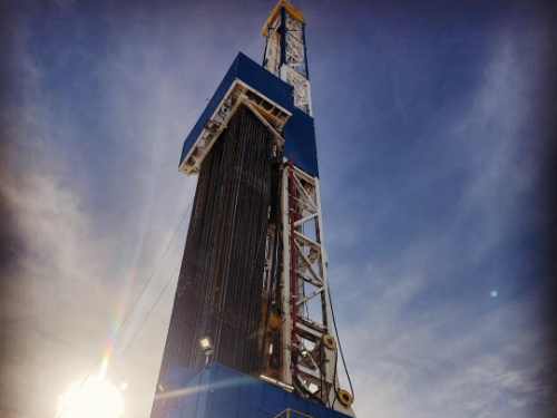 Picture of oil rig looking from the ground.